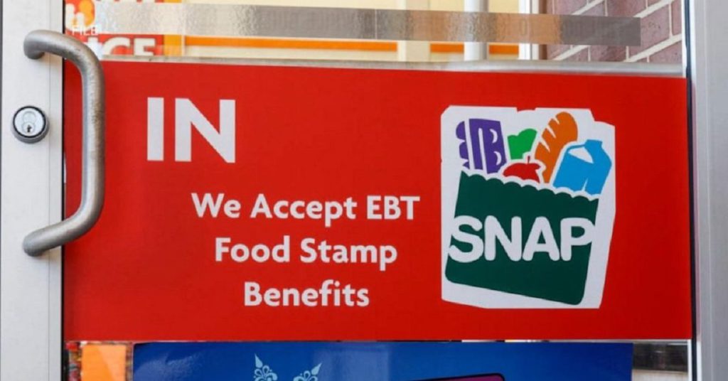 EBT sign on a door at a convenience store