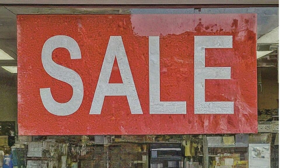 A sale sign on a grocery store window display. Photo design by NRS