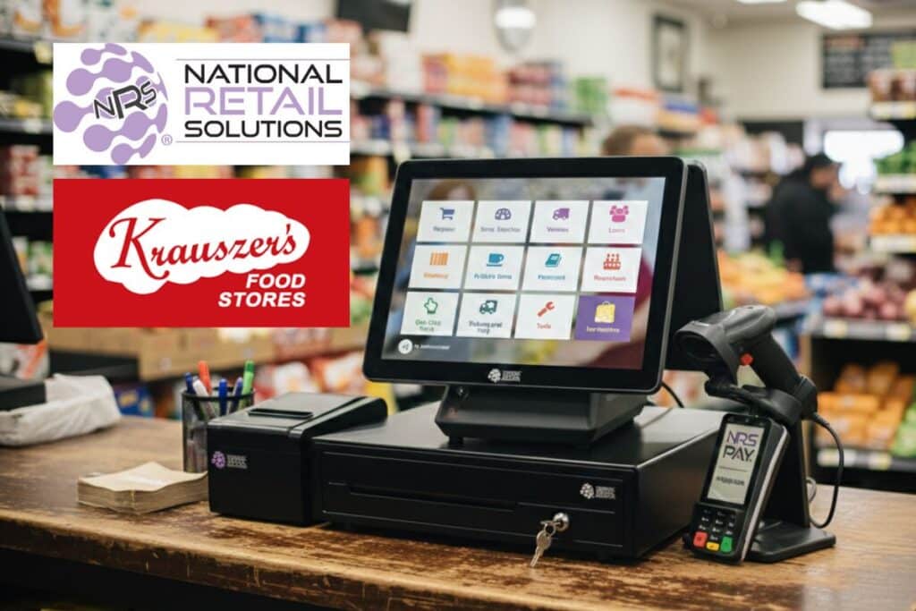 An NRS (National Retail Solutions) point-of-sale system featuring a touchscreen terminal, barcode scanner, and credit card reader on a checkout counter at a Krauszers Food Store