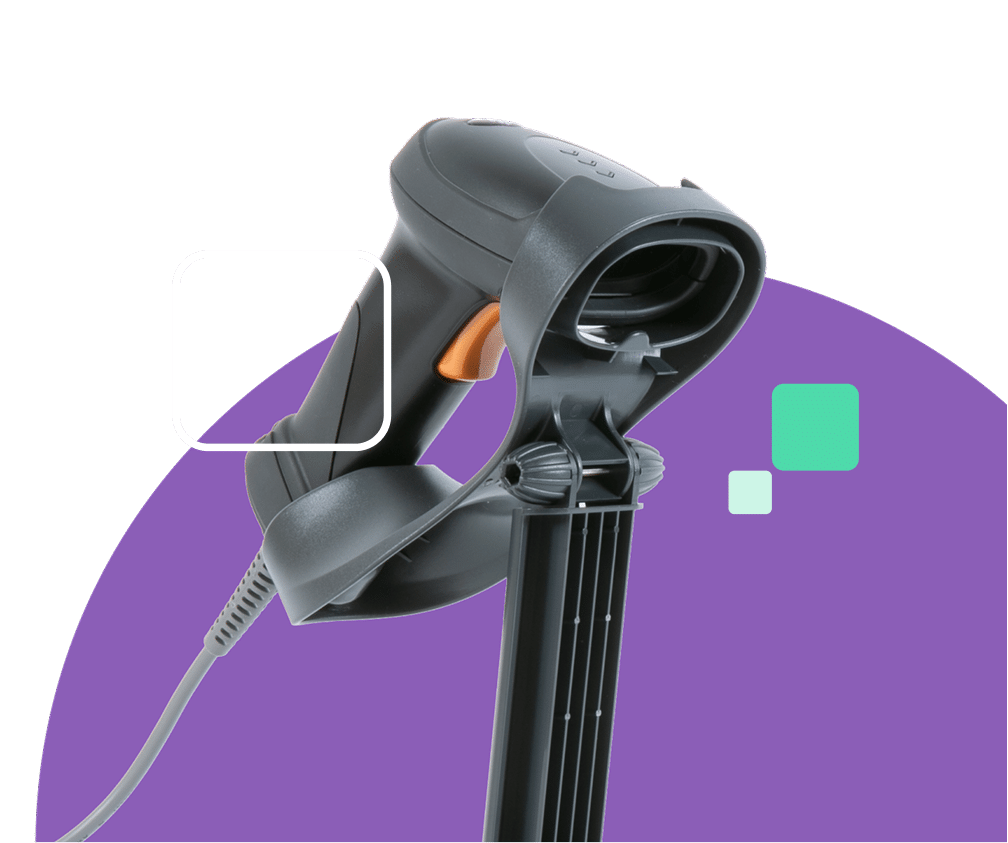 A black barcode scanner with an orange trigger button rests on its stand, with a gray cord extending from its base
